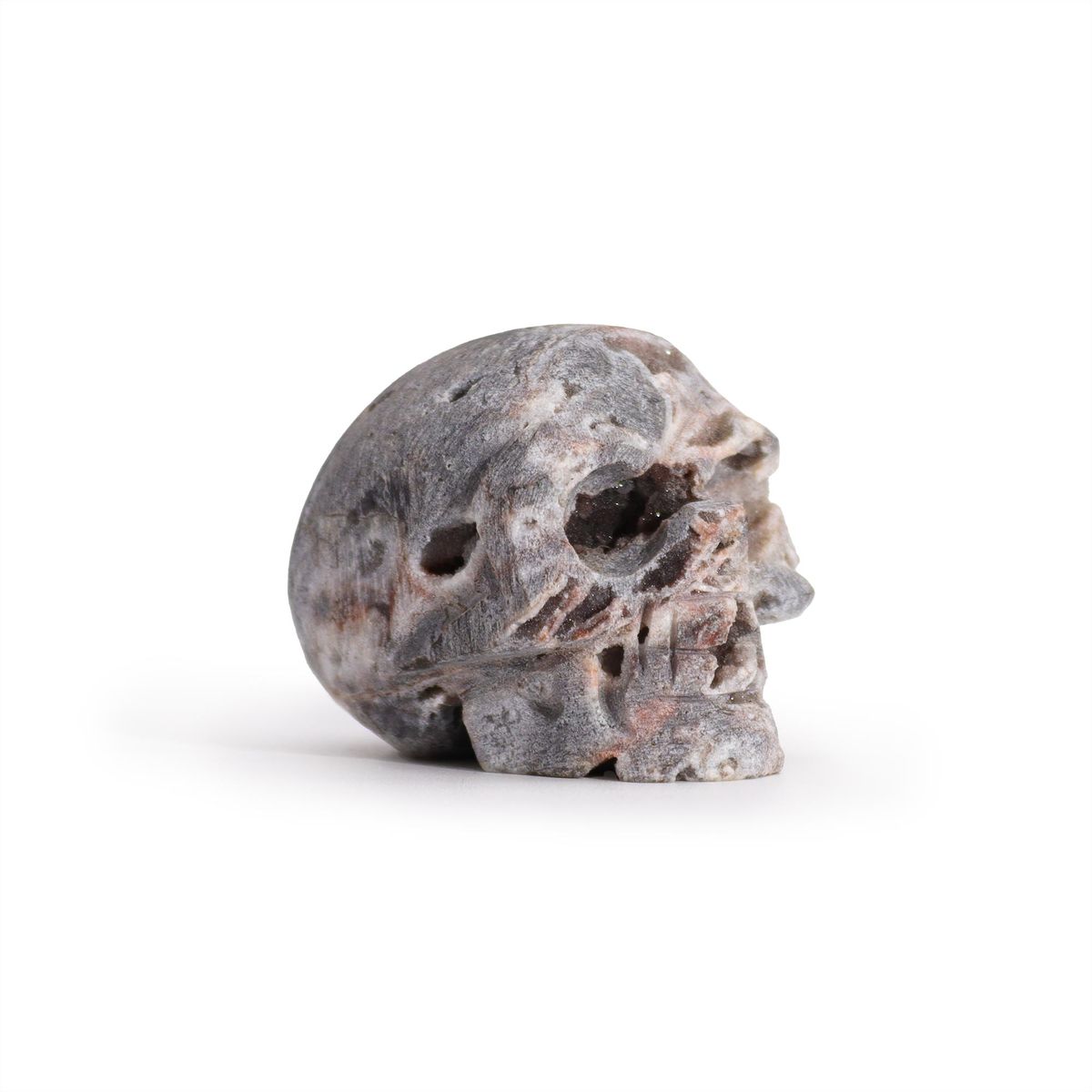 Crânio esculpido em geodos de calcita - (aprox. 4,5 cm)
